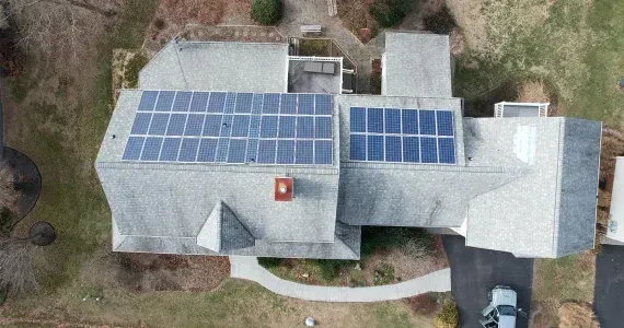 Solar panels installed on a residential asphalt shingle roof in Maryland.