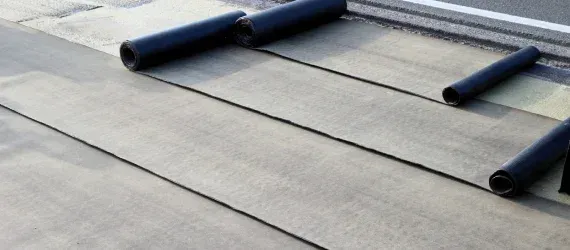 Roll roofing installation on a residential roof in Maryland