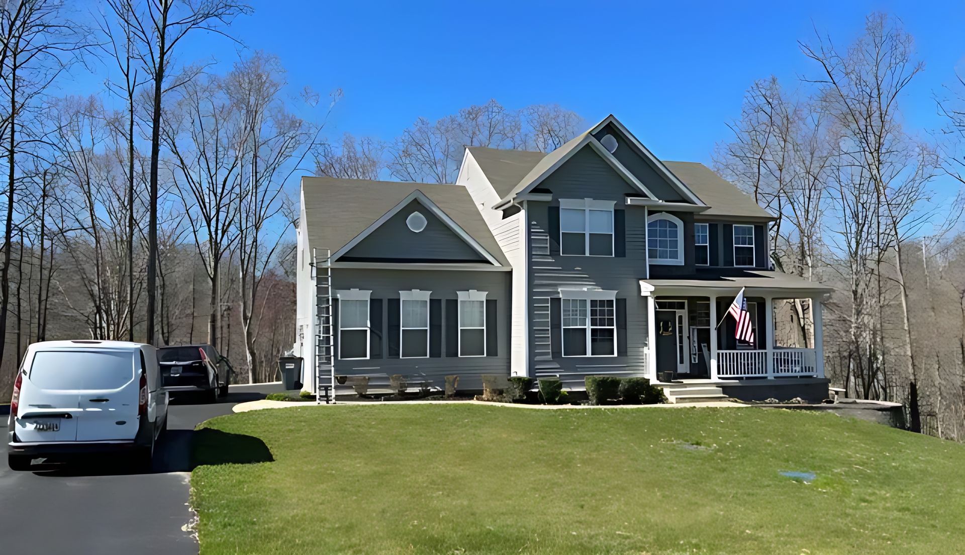 Asphalt shingle roof installation on a grey residential home in Laurel, Maryland.