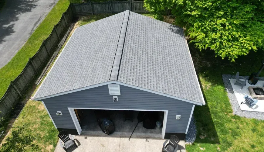 Shingle roof and siding installation on a residential garage in Baltimore County, Maryland