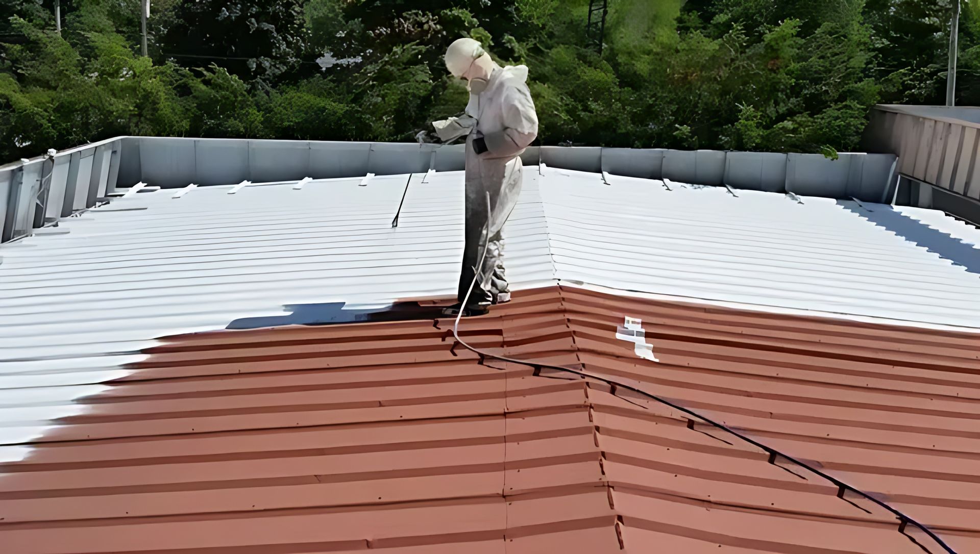 Application of roof coating on a commercial metal roof in Maryland.