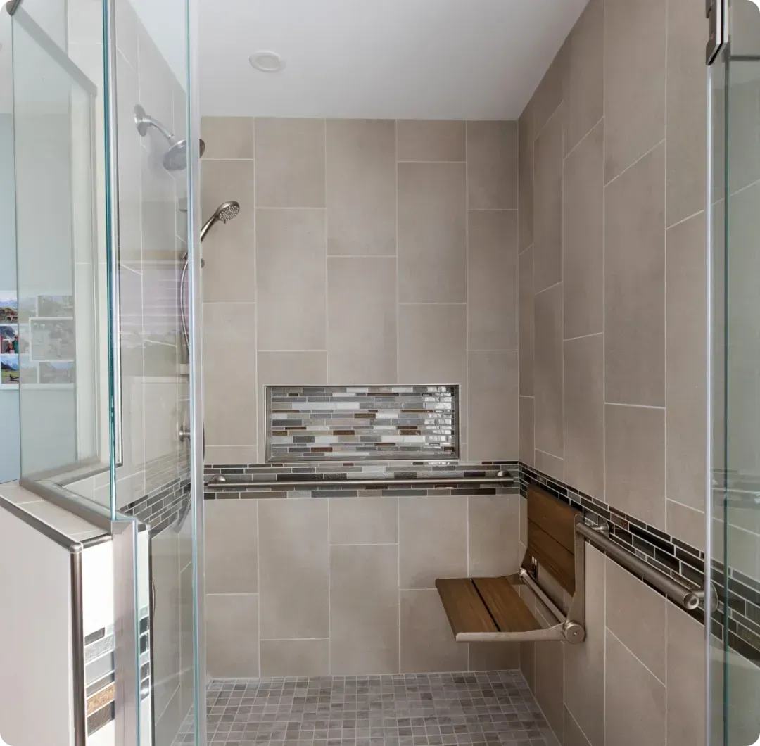 Custom bathroom remodel with modern tile and fixtures by Bella Domicile