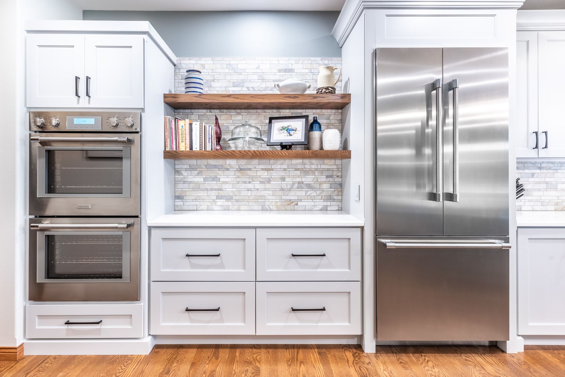 Modern kitchen renovation with open layout and new finishes by Bella Domicile