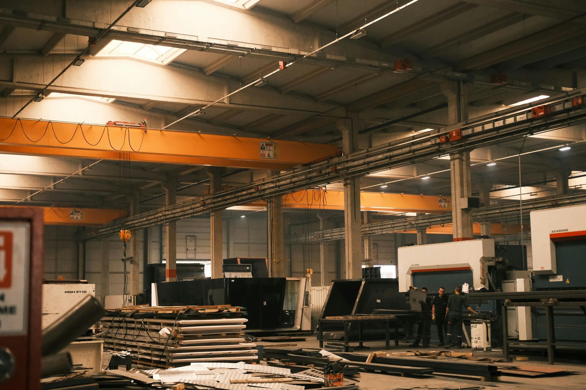 A large warehouse with a lot of machinery in it.