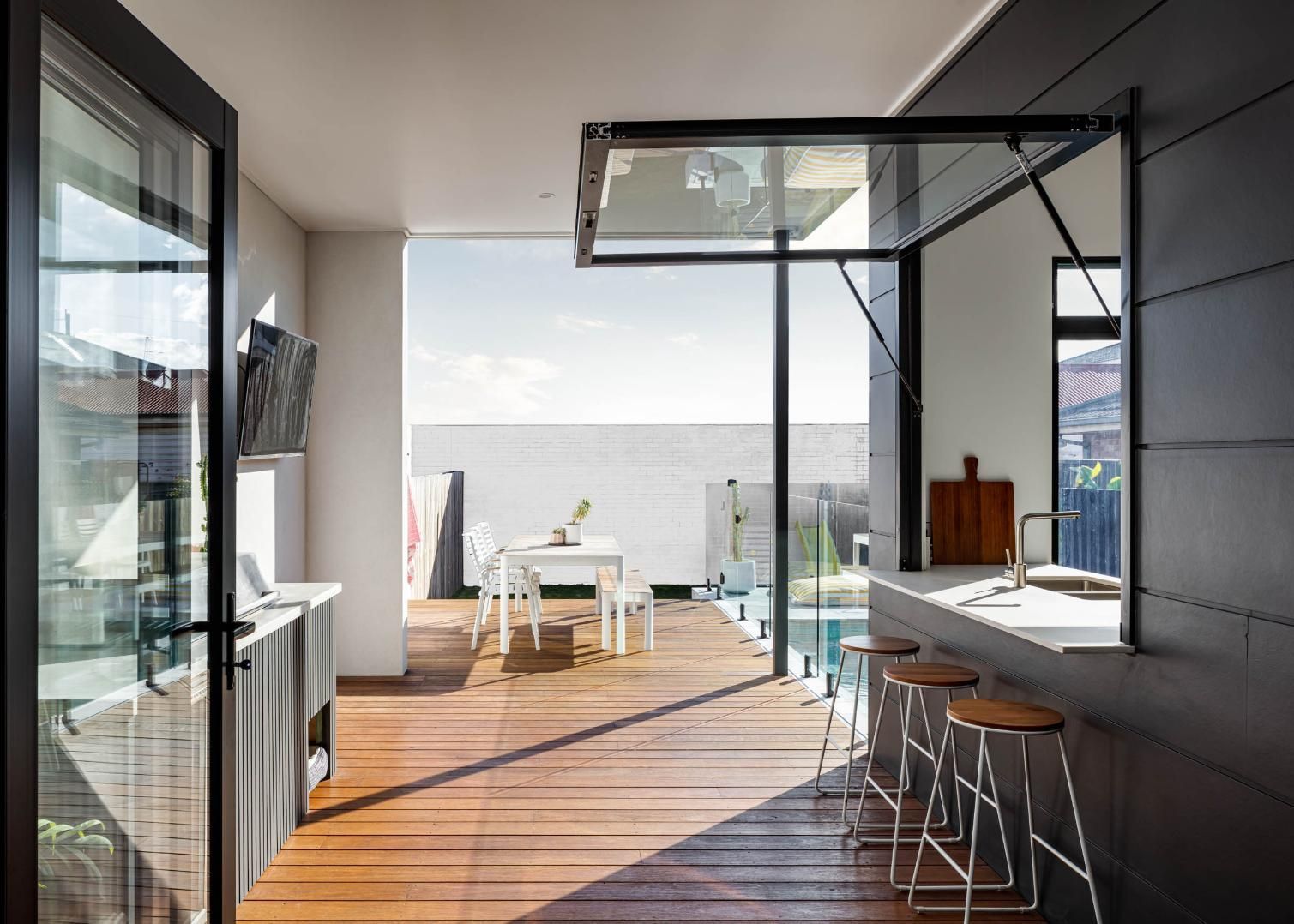 Outdoor Courtyard with Large Sliding Glass Doors — Goode By Design in Unanderra, NSW