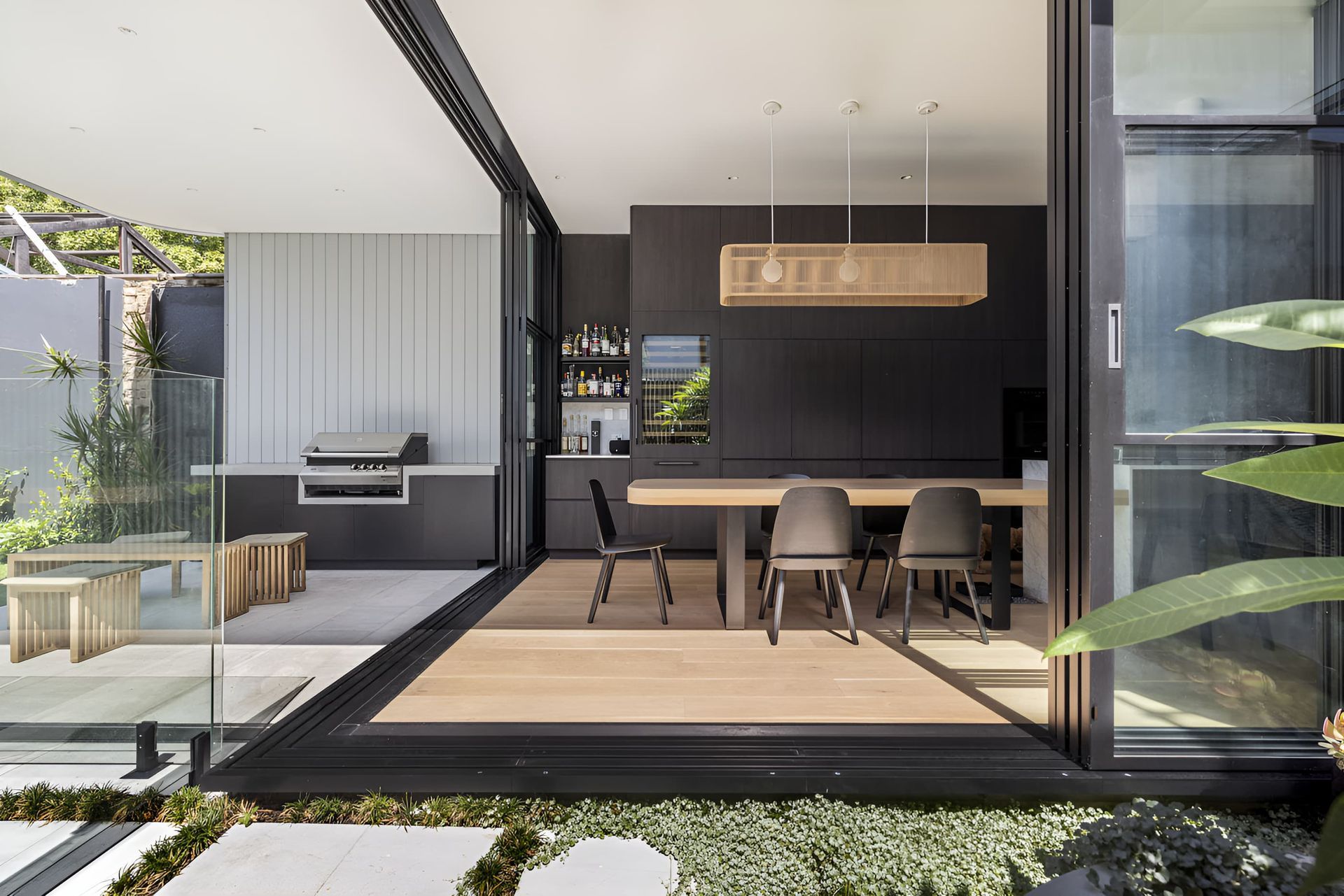 An outdoor area with a table and chairs and BBQ — Jono Goode Joinery in Unanderra, NSW