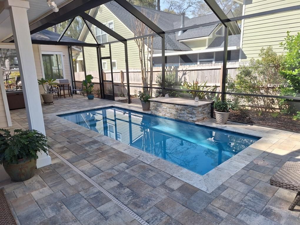 Custom geometric cocktail pool with waterfeature