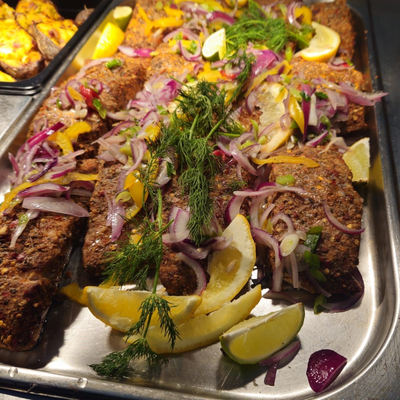 A buffet line with many different types of food