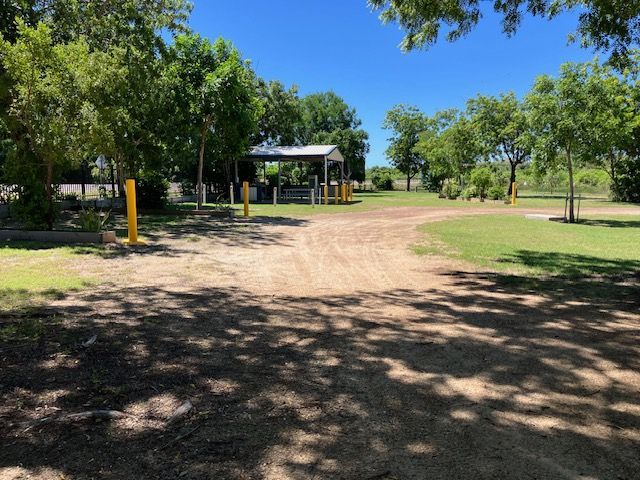 Dirt Road in a Park Leading to a Covered Structure — Karumba Point Holiday Tourist Park in Karumba, QLD