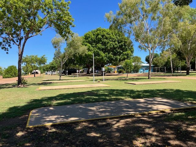 Park With Shaded Camping Pads, Trees, and Blue Sky — Karumba Point Holiday Tourist Park in Karumba, QLD