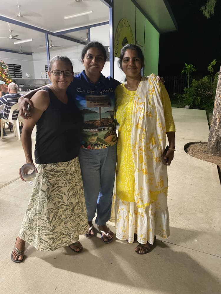 Three Women Smiling and Posing Outdoors; One in a Black Tank, One in a Colorful Shirt — Karumba Point Holiday Tourist Park in Karumba, QLD