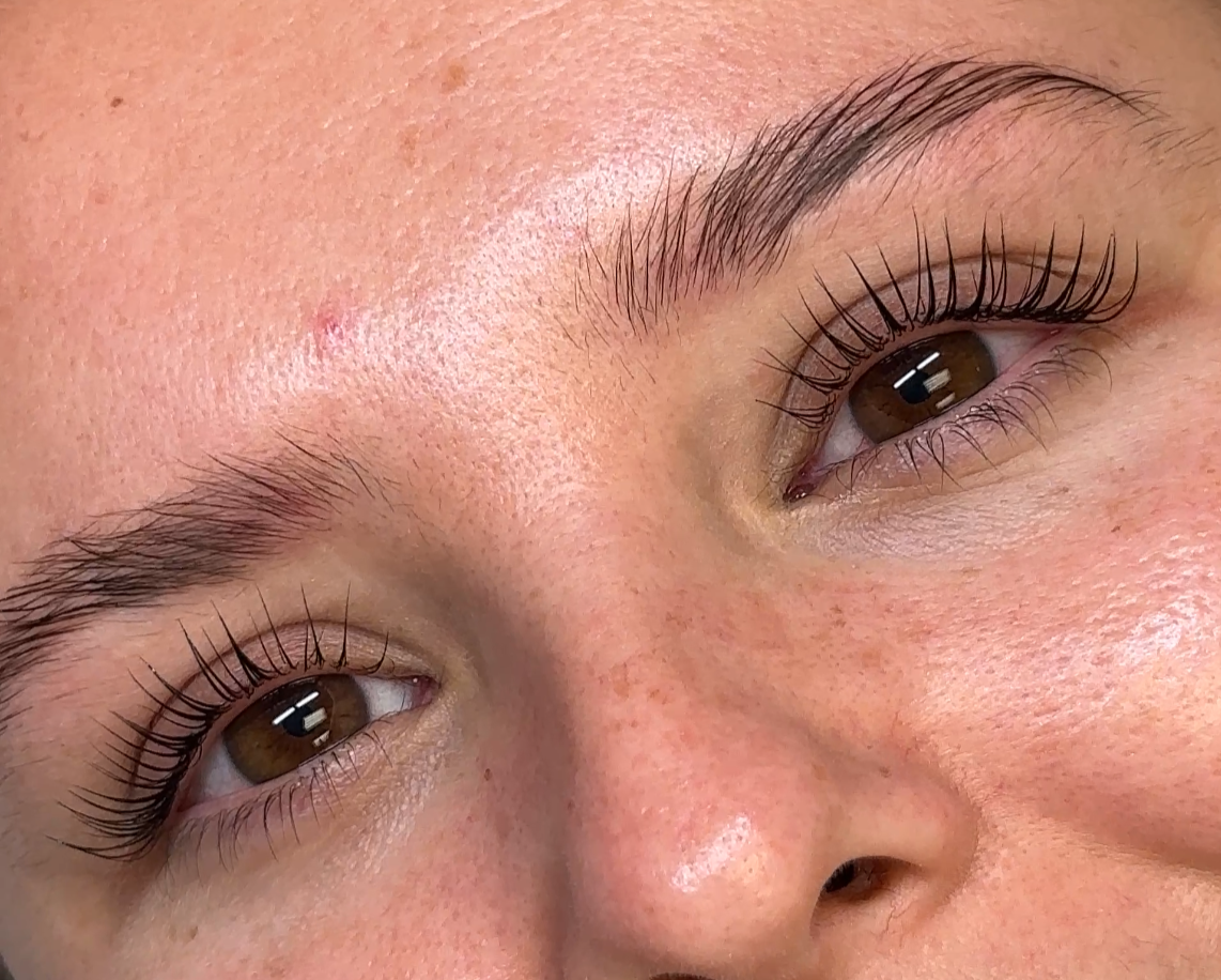 A woman is getting her Korean Lash Lift done at a hair removal salon A woman is getting her Korean Lash Lift done at a hair removal salon