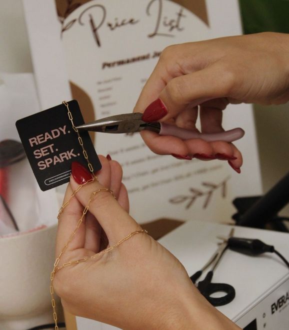 A woman is getting her legs waxed in a beauty salon.
