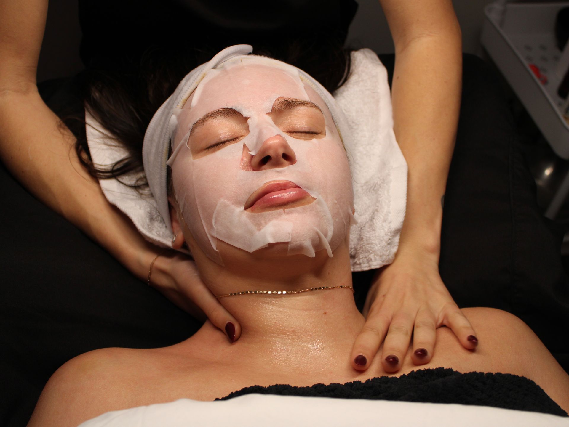 A woman is getting eyelash extensions at a beauty salon. A woman is getting eyelash extensions at a beauty salon.