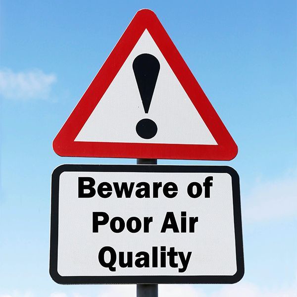 A sign that says beware of poor air quality