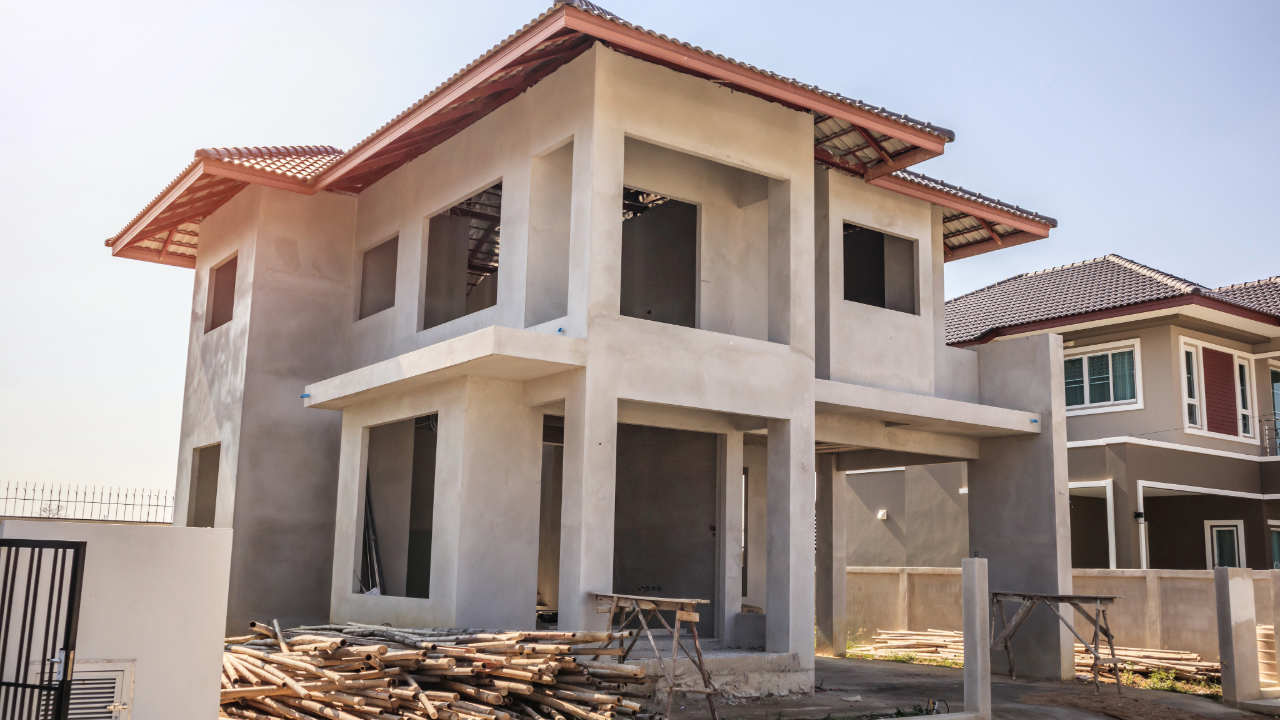 A house is being built in a residential area.