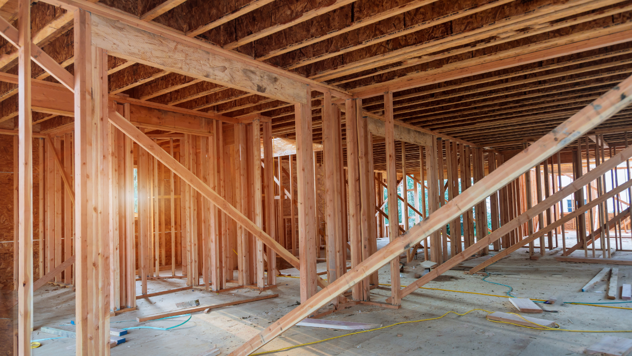A house is being built with wooden beams.
