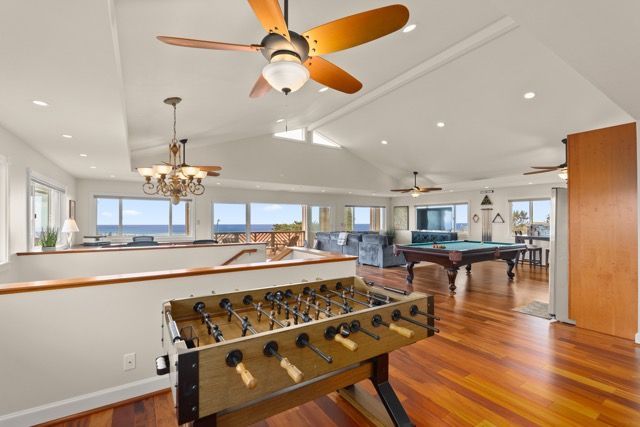 There is a foosball table in the middle of the room.