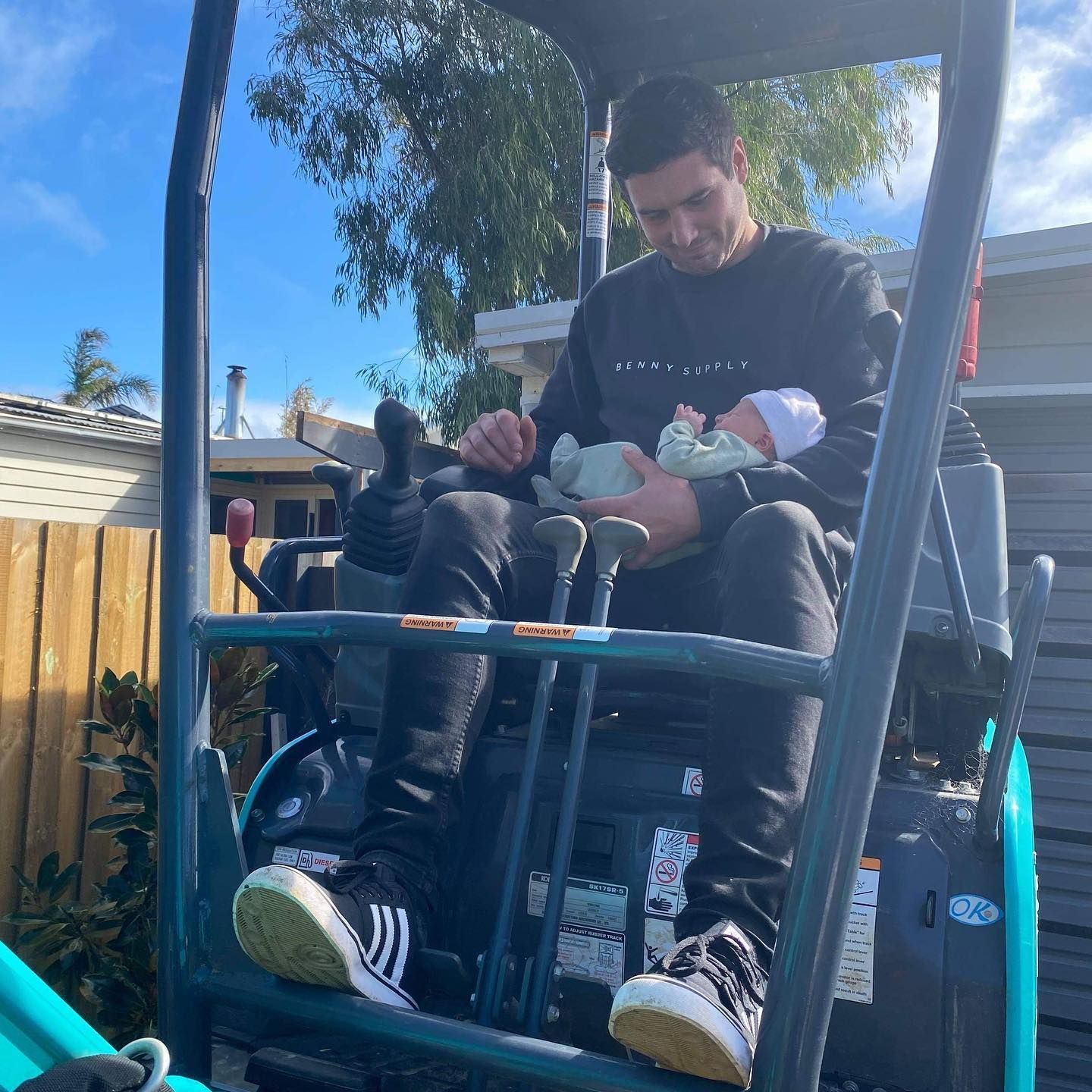 excavator operator with child
