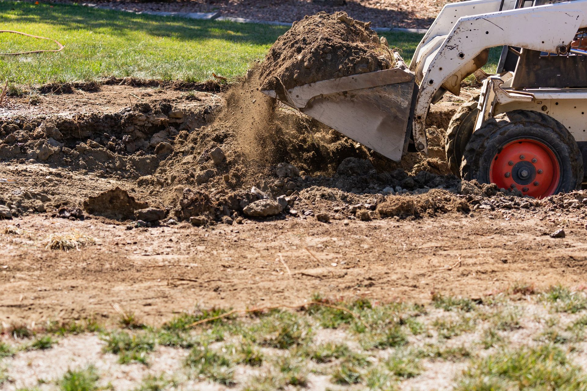A bulldozer is digging a hole in the ground.