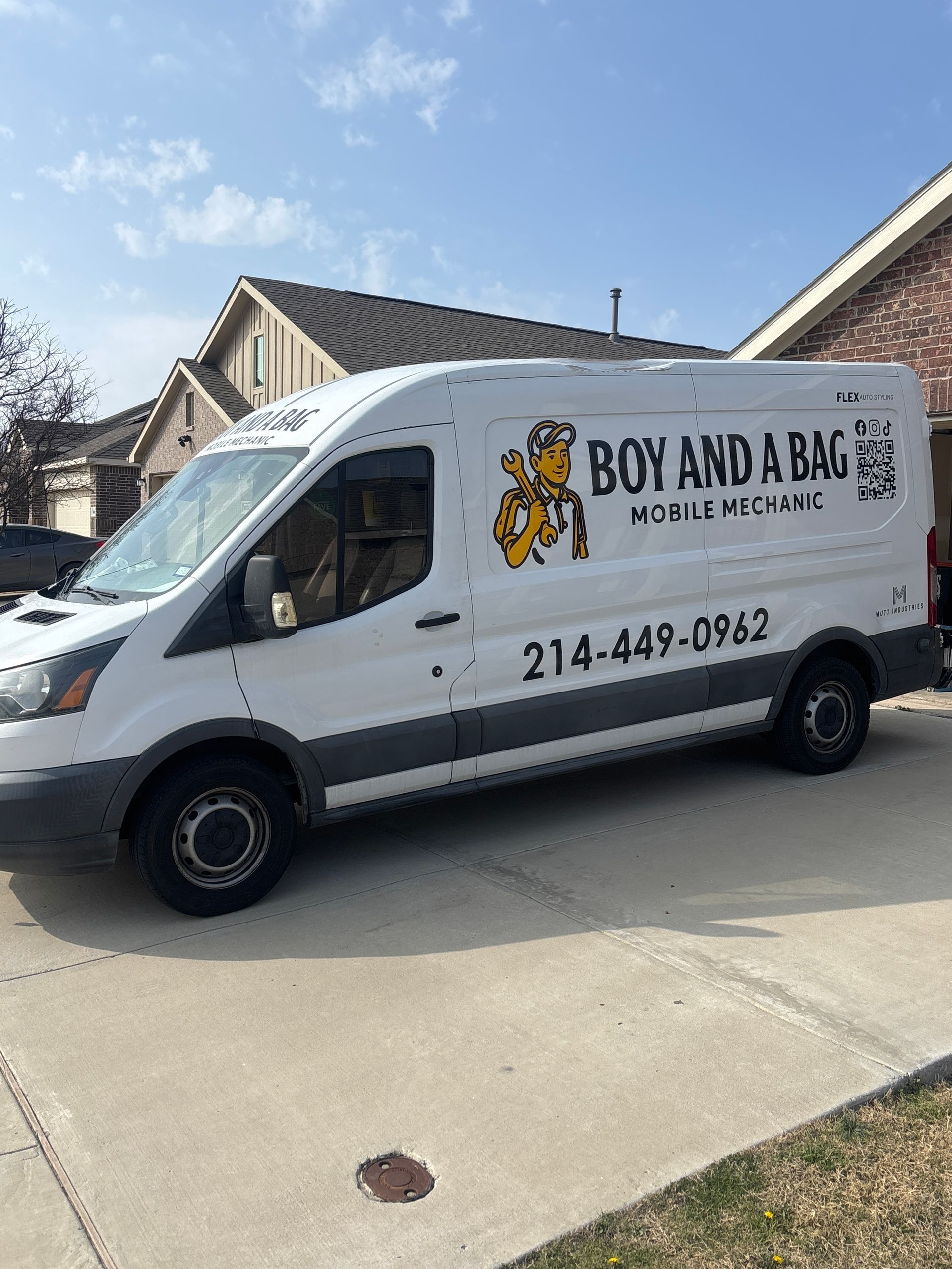 Bow and Arrow mobile locksmith van parked in a suburban driveway under a blue sky