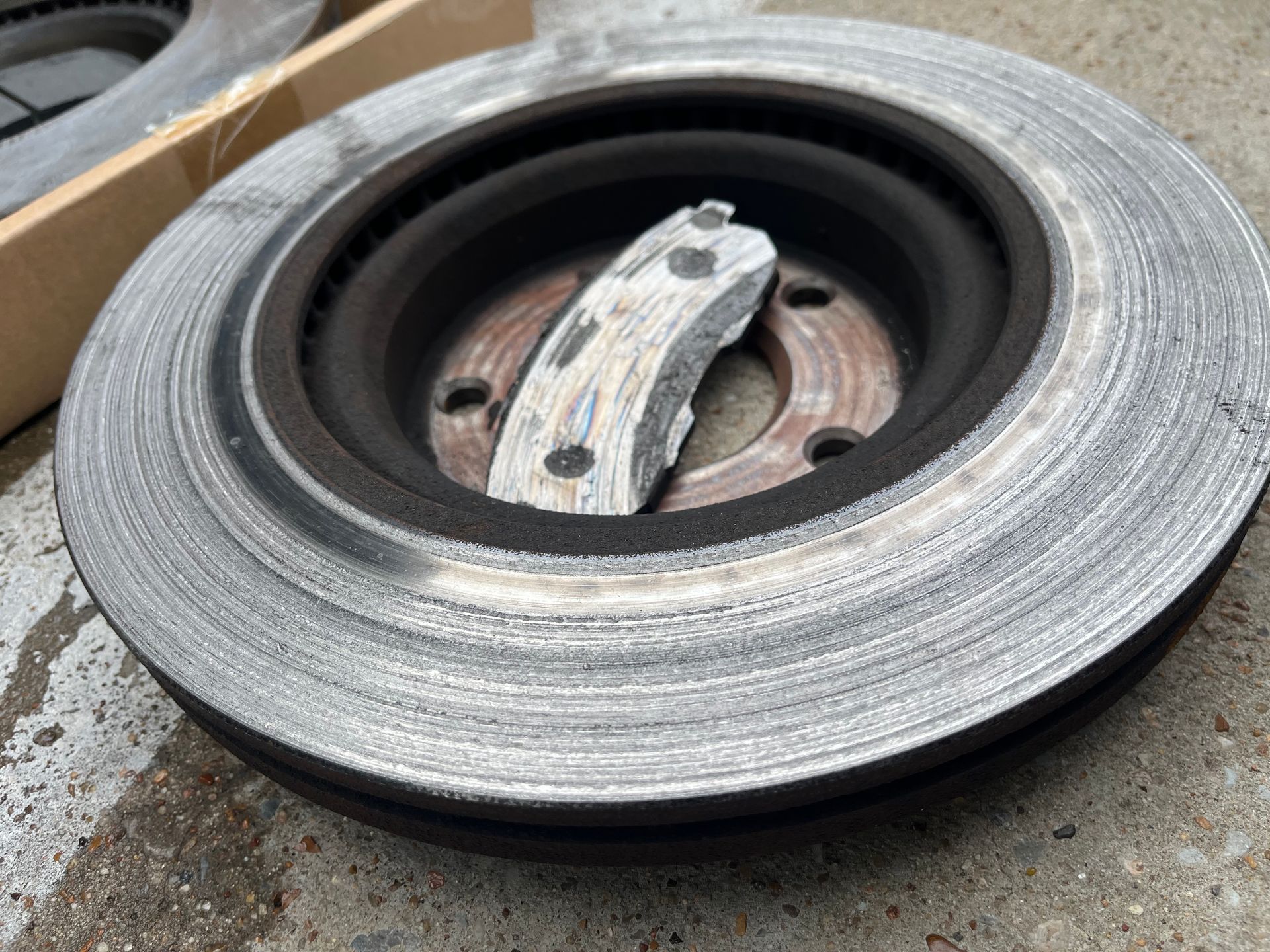 Damaged car wheel with worn tire and exposed rim close-up