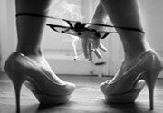 Sensual massage girl smoking a cigarette