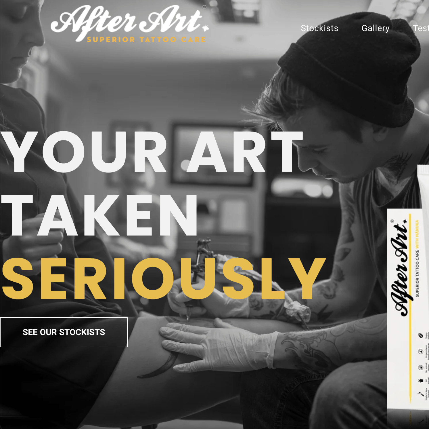the website for after art shows a man getting a tattoo