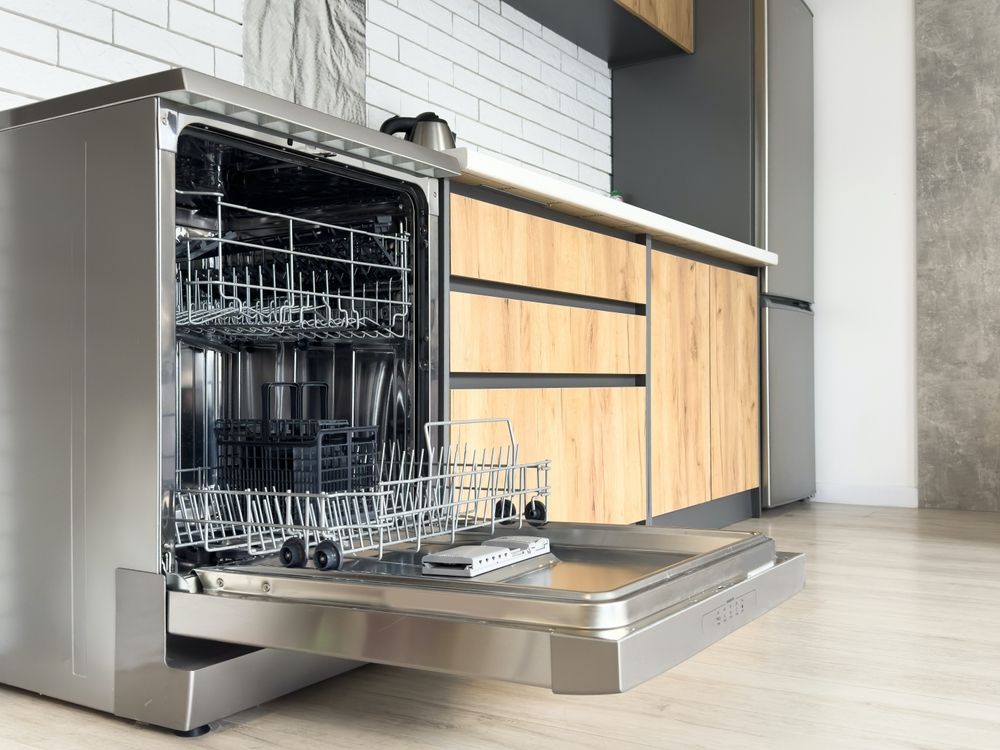 A Dishwasher Is Open In A Kitchen With The Door Open — Tweed Heads Appliance Repairs In Tweed Heads, NSW
