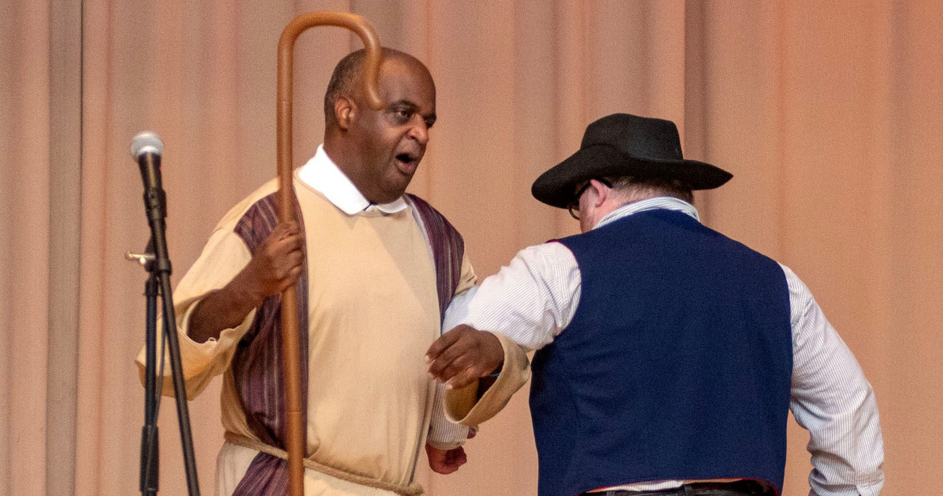 Two men singing and spinning each other 'round during OGC's Summer Showcase show.
