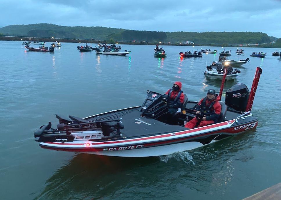 A convoy of fishing boats idling on Lake Chickamauga, waiting for Orange Grove's Fishing Tournament to start.