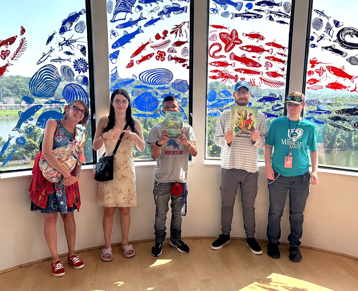 A group photo of individuals in Orange Grove's Psychosocial Rehabilitation Program visiting the Hunter Museum.