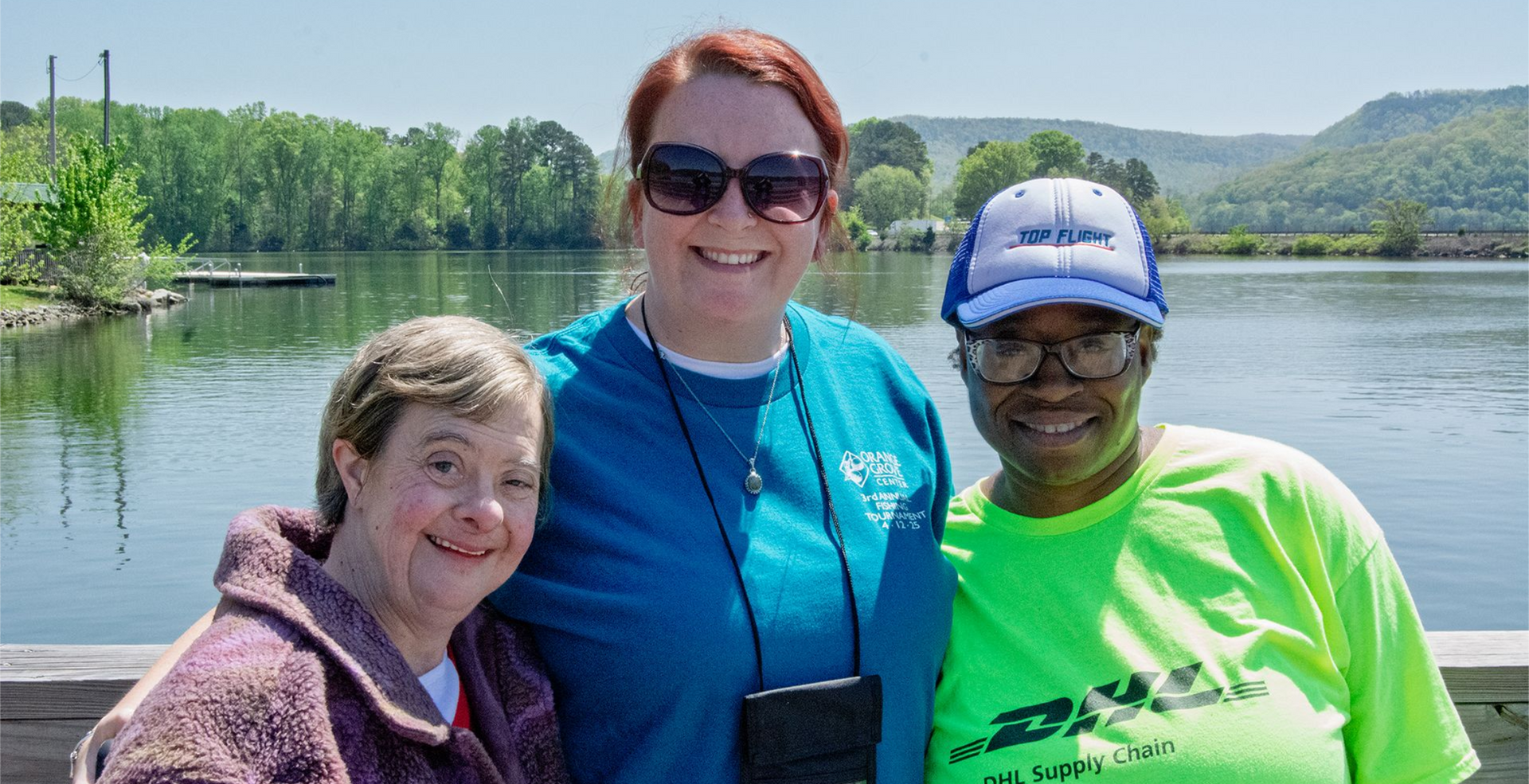 Three women smiling in a photo taken at Orange Grove's 2025 Fishing Tournament on the TN River.