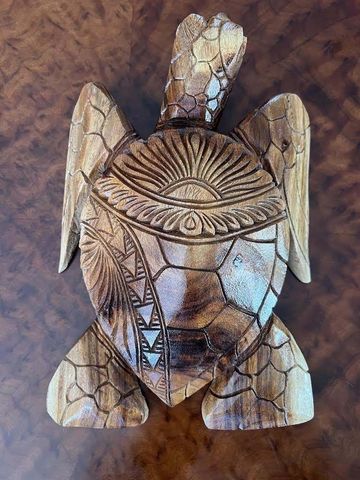 A Totem Pole with A Face Carved Into It — Aiea, HI — Auvaa Island Made LLC A Totem Pole with A Face Carved Into It — Aiea, HI — Auvaa Island Made LLC