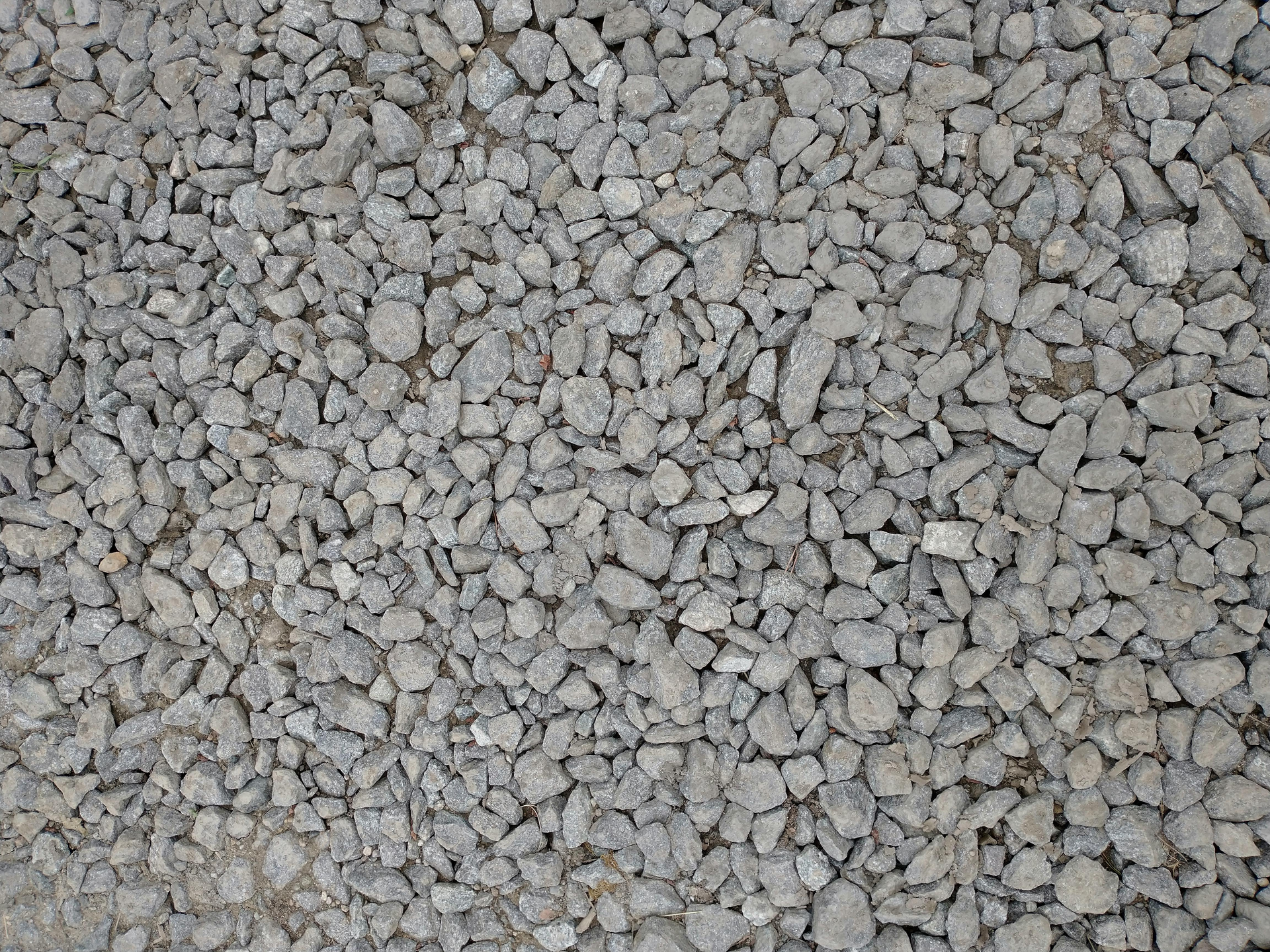 Close-up of gray gravel stones filling the frame