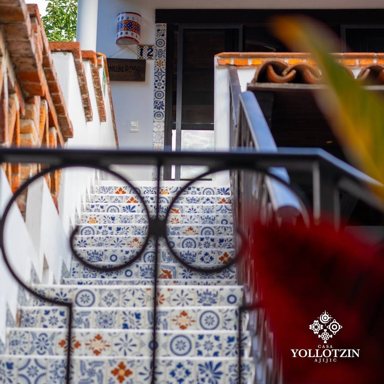 Stairs leading up to a building with the word yollotzin on the bottom