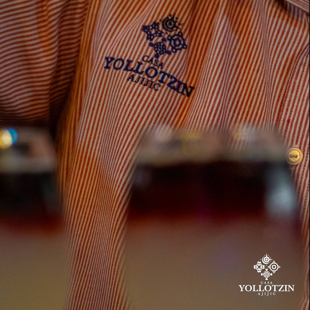 A striped shirt with the word yollotzin on it