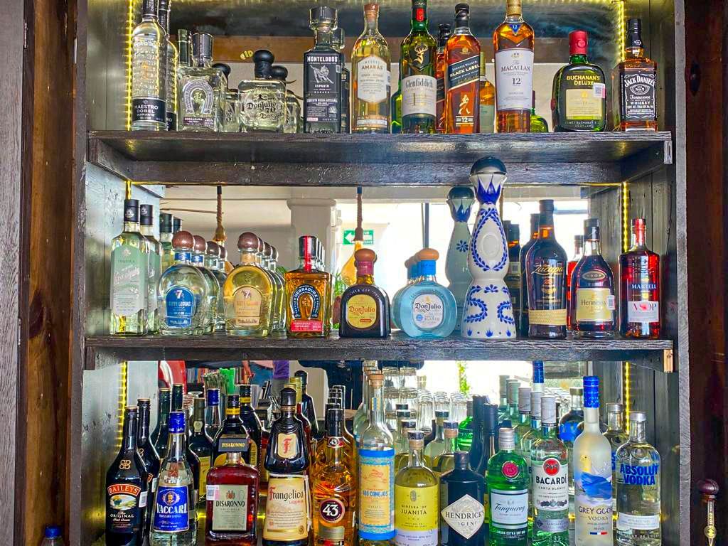 A bar filled with lots of bottles of liquor