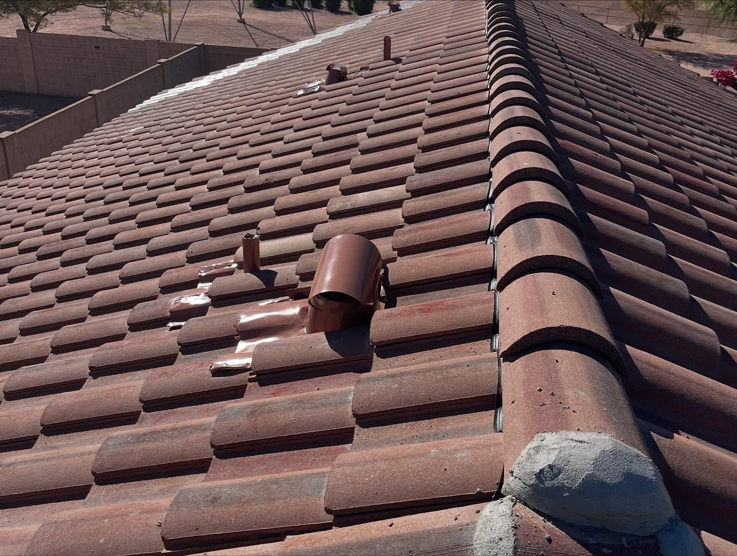 Clay tile roof with vent pipes.