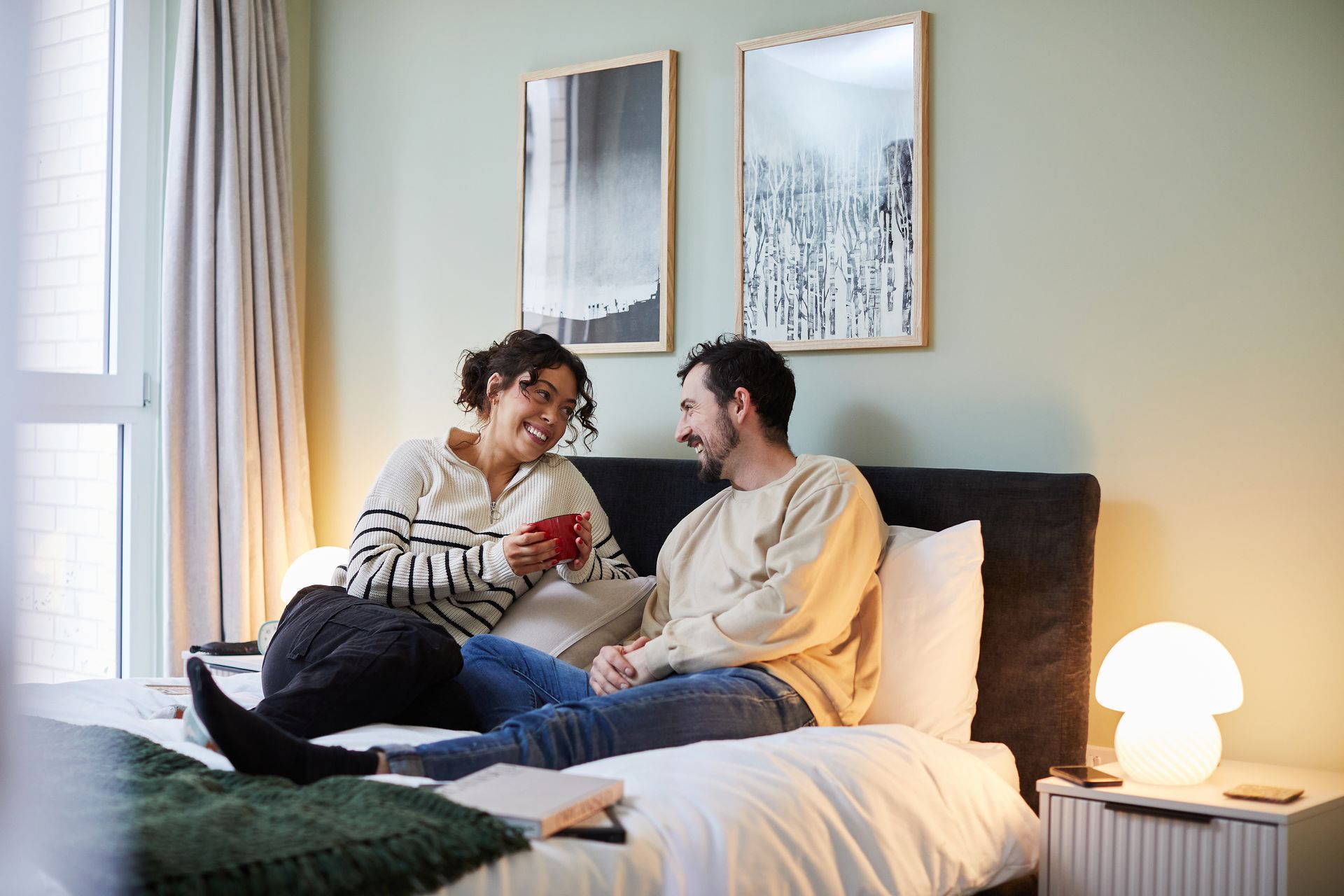 Woman and man on bed at Stafford Yard Bristol.