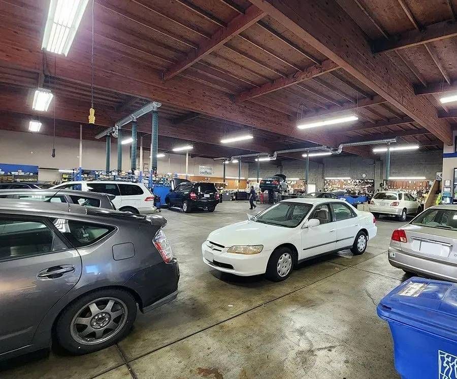 Technicians working on cars at our auto repair shop | Berkeley Minicar