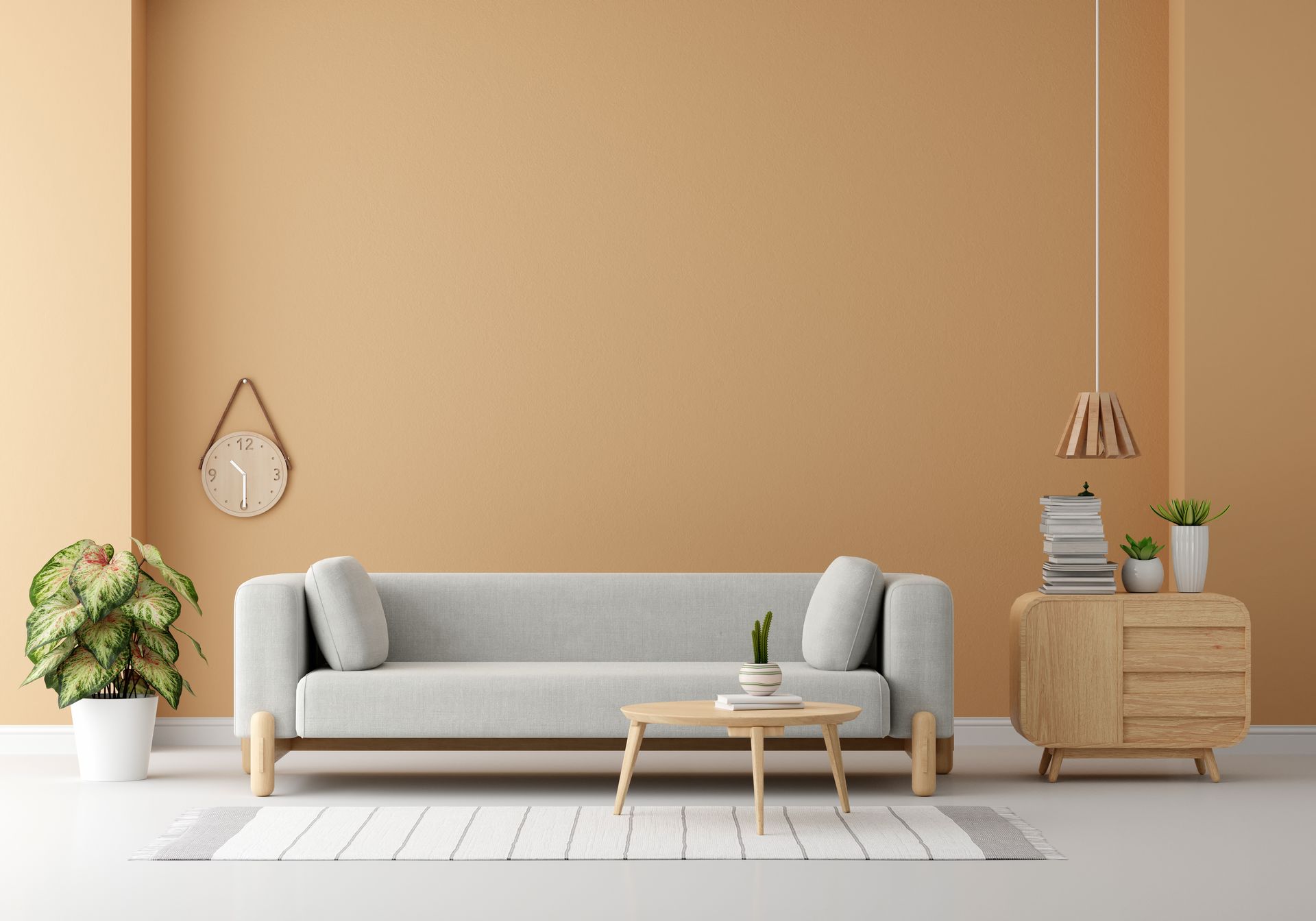 A living room with a couch , table and clock on the wall.