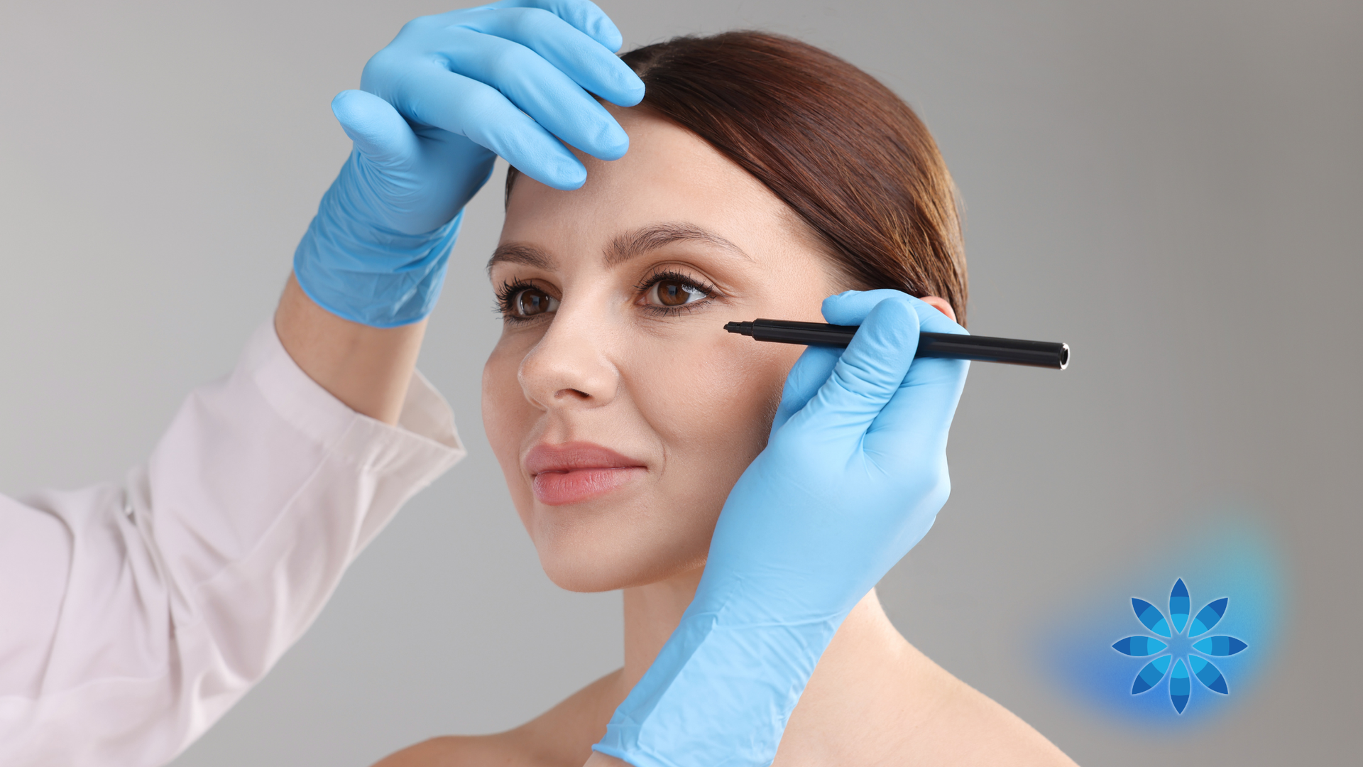 Doctor marking patient's face with a pen. Person in blue gloves and lab coat preparing for cosmetic procedure.