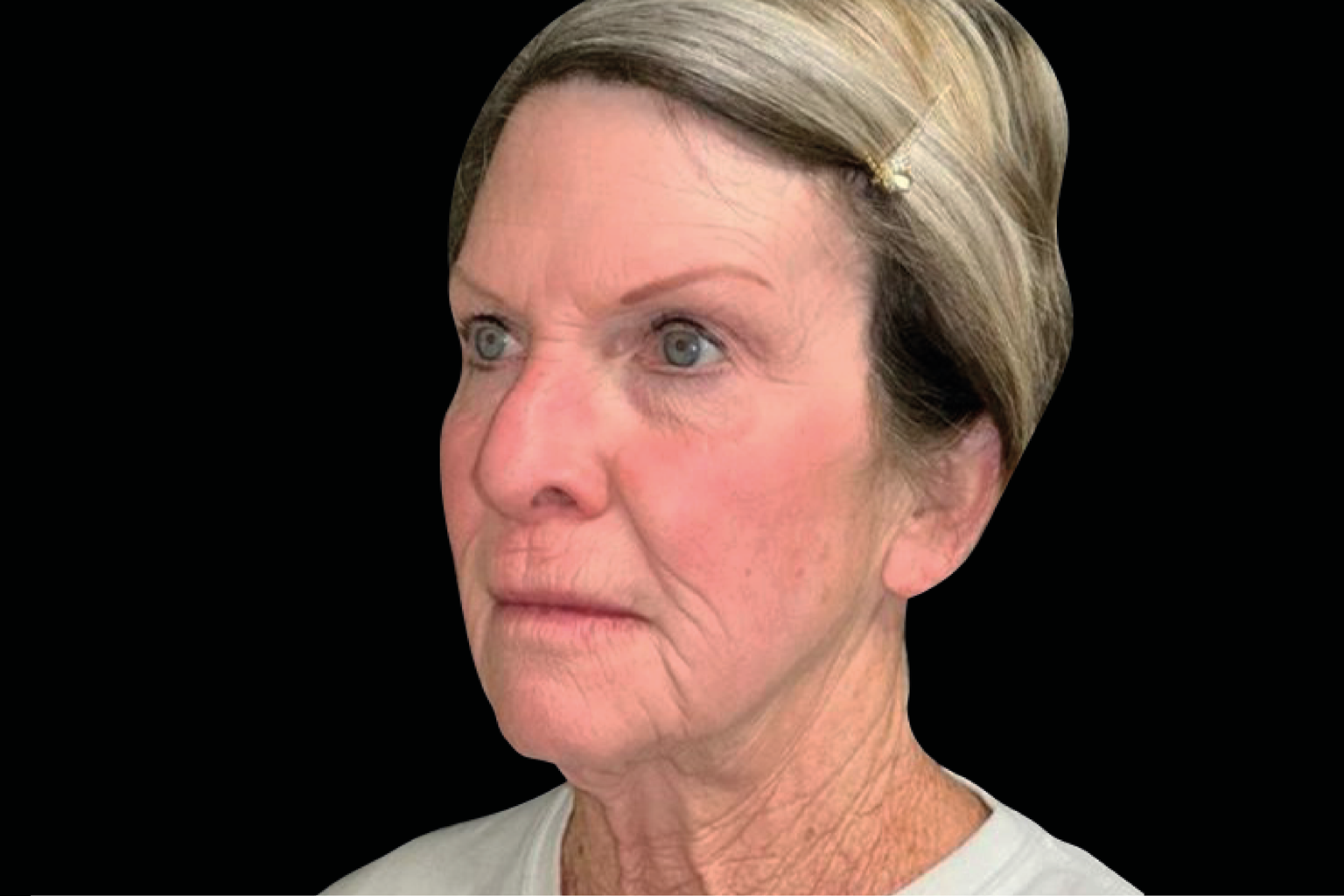 Side-profile portrait of a woman with gray hair against a black background, neutral expression