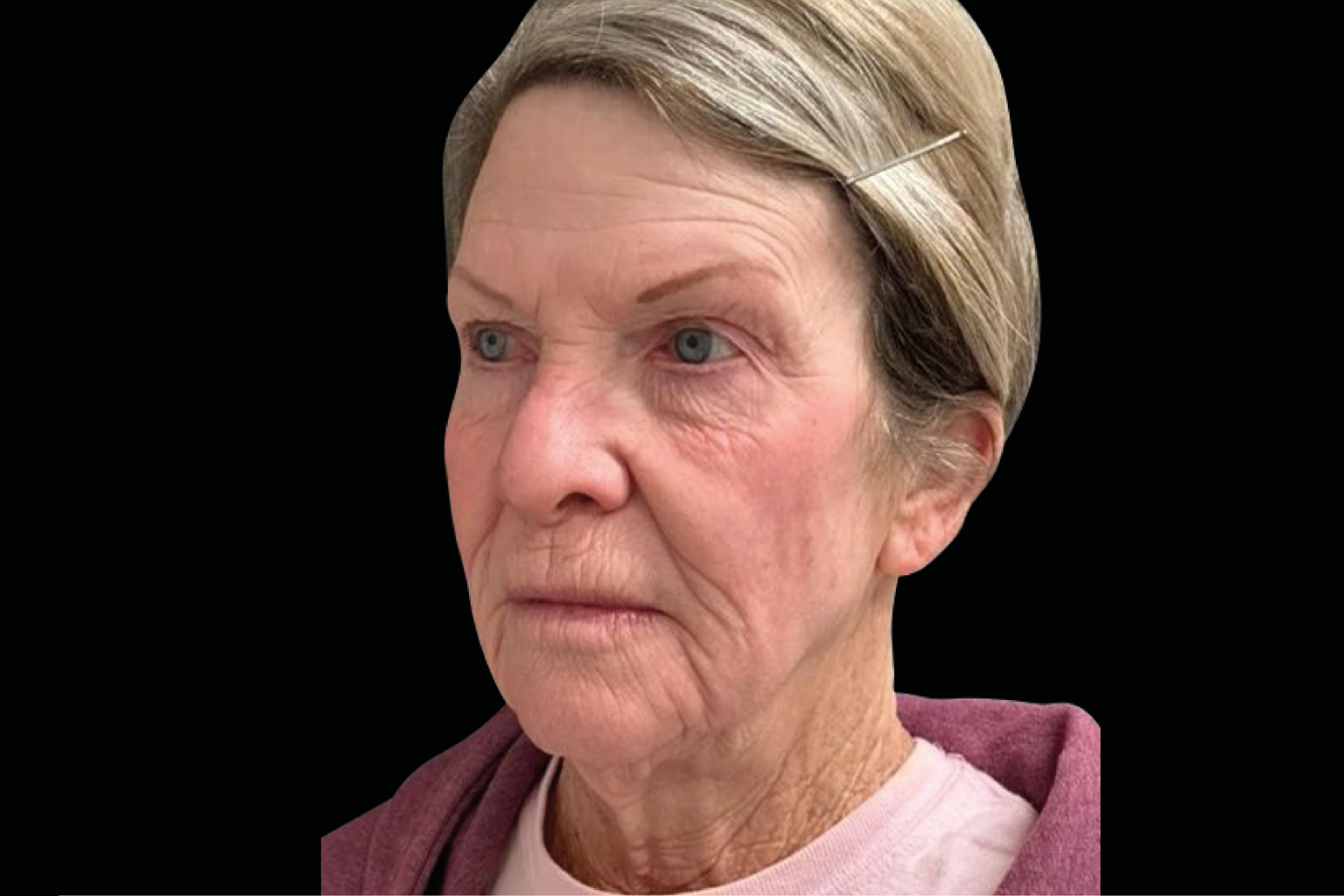 Close-up portrait of a woman with a solemn expression against a black background