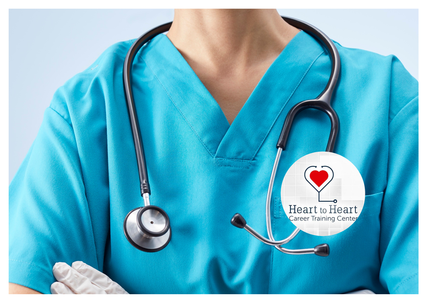 Person in blue scrubs with a stethoscope around their neck, logo on the front.