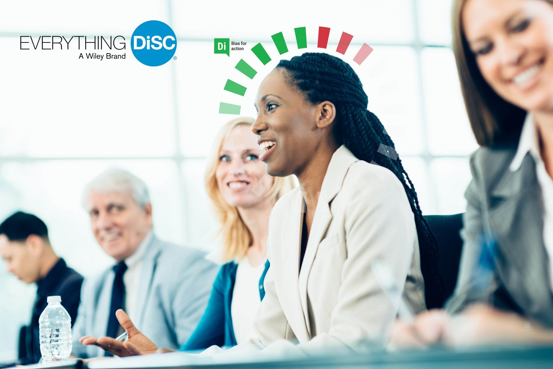 A group of people are sitting at a table with a sign that says everything disc
