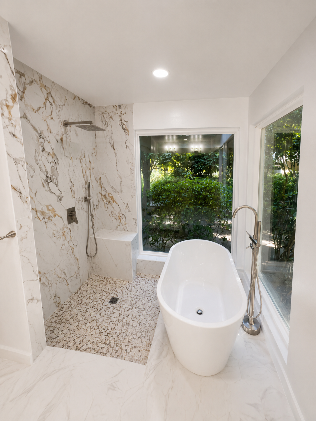 A bathroom with a toilet , sink , bathtub and mirror.