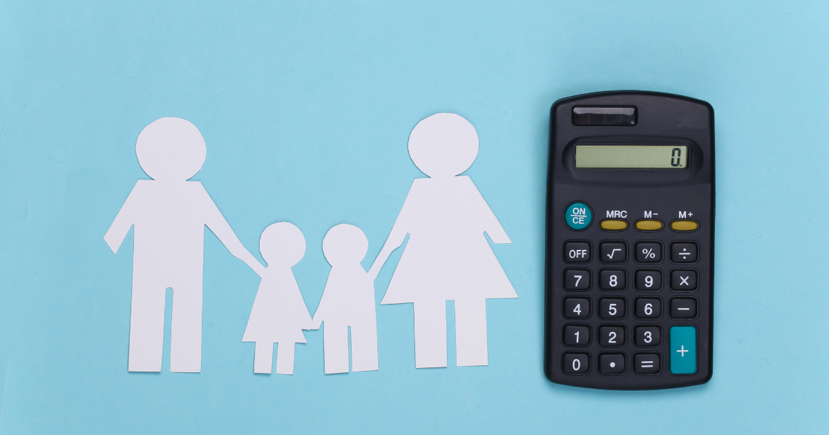 Paper family silhouettes beside a black calculator on a light blue background
