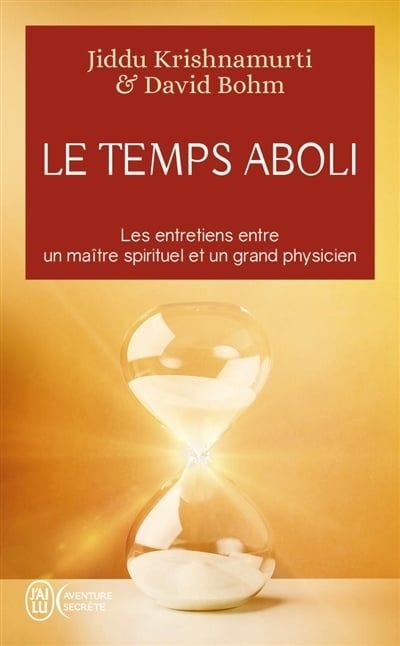 Couverture du livre : « Le Temps Aboli », ornée d’un sablier, dans des tons rouges et or. Illustrations de Jiddu Krishnamurti et David Bohm.